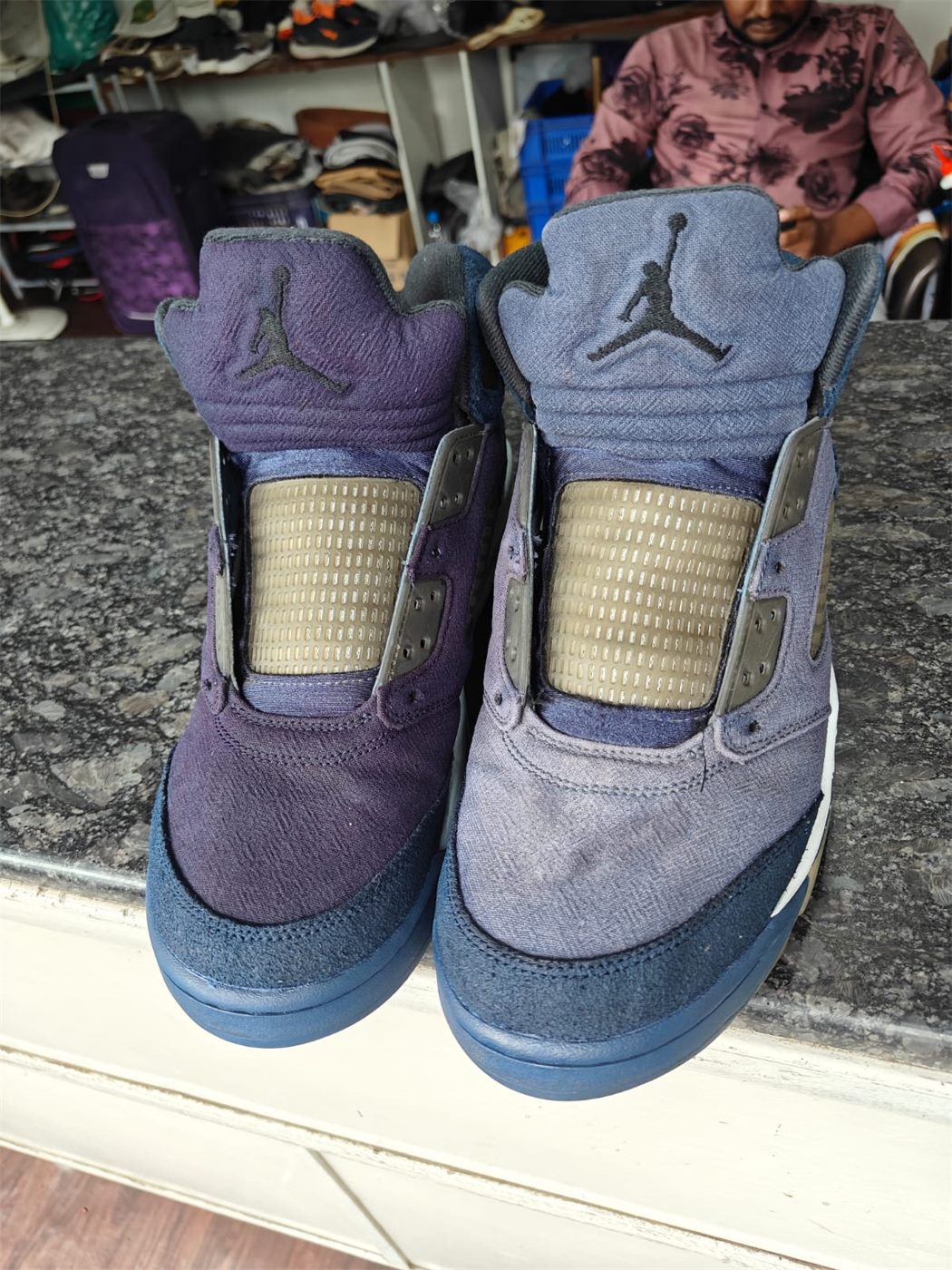 Air Jordan 5 denim pair, one shoe cleaned and one not